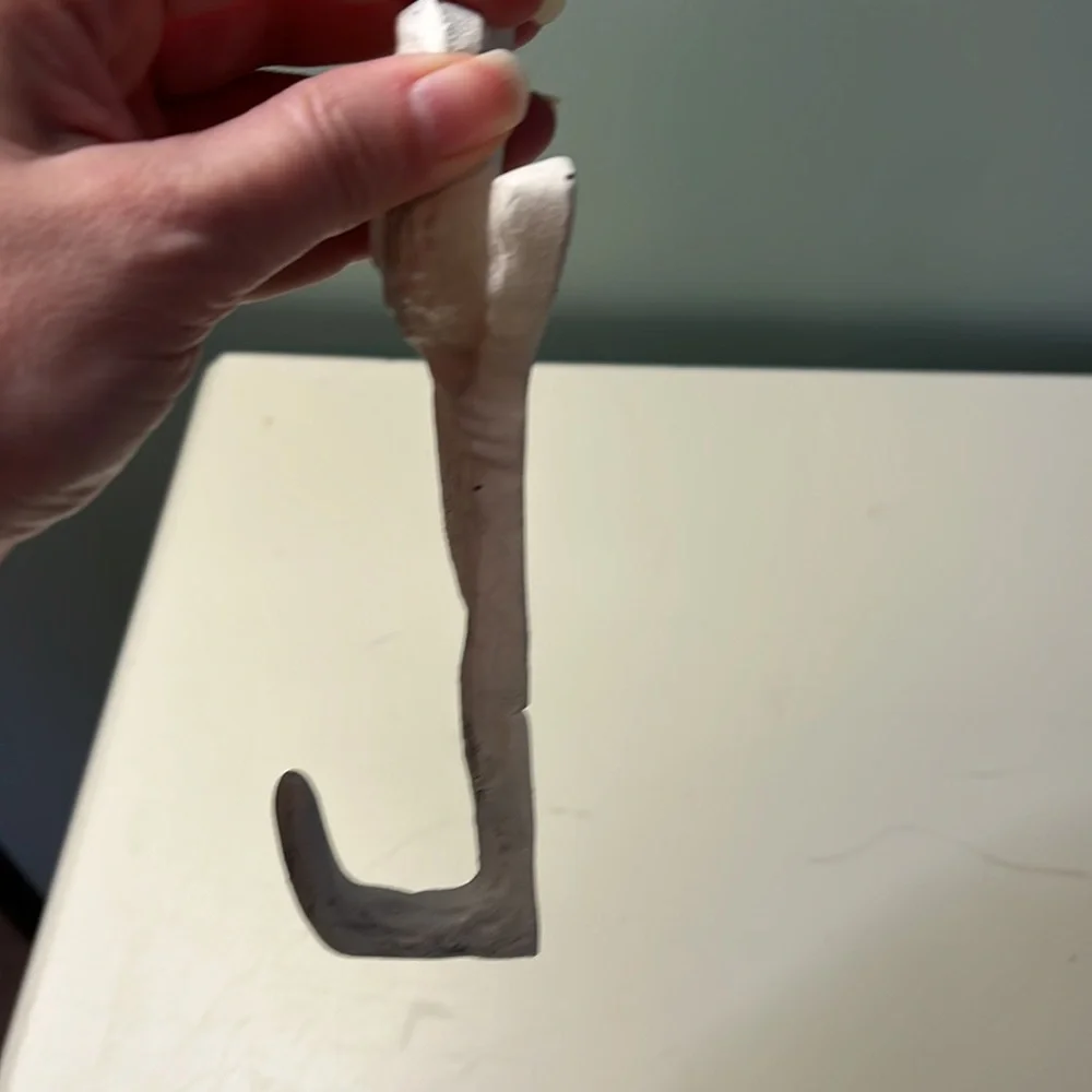 Bird and branch coat hook.